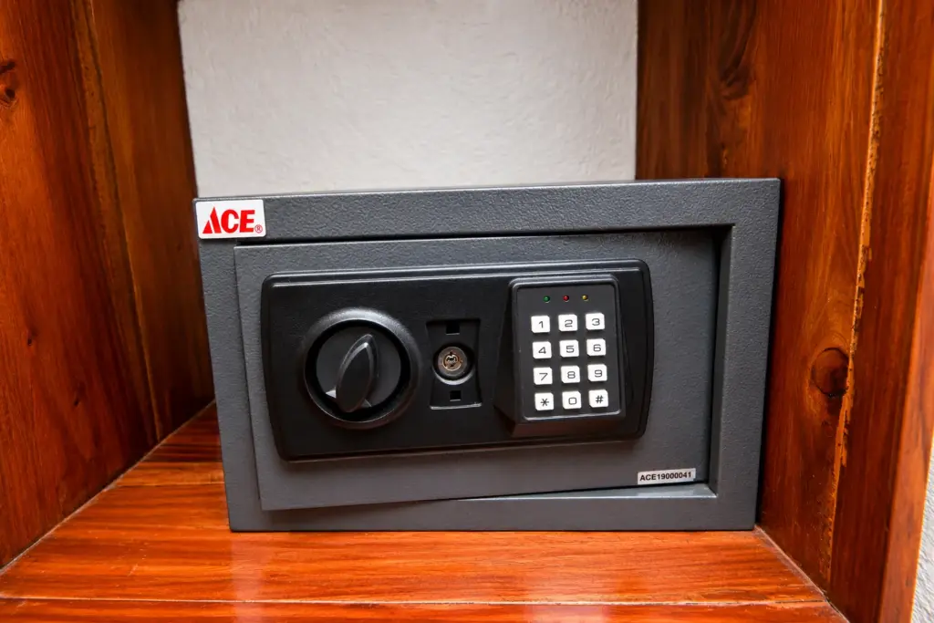 In-room safe in a wooden alcove