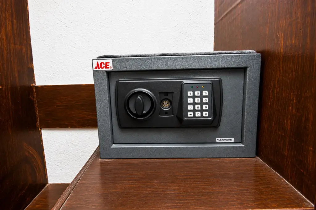 In-room safe on a wooden shelf