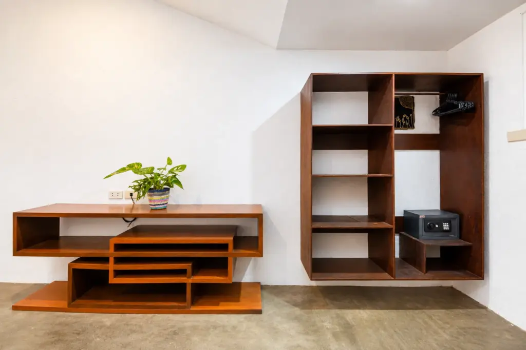 Open wooden shelving and storage with a plant